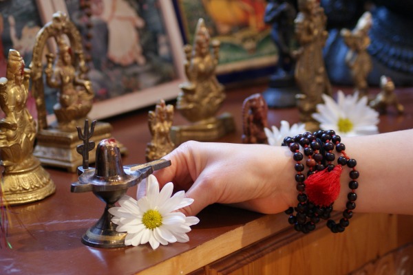 offering flowers at alter - puja - toronto sivananda yoga