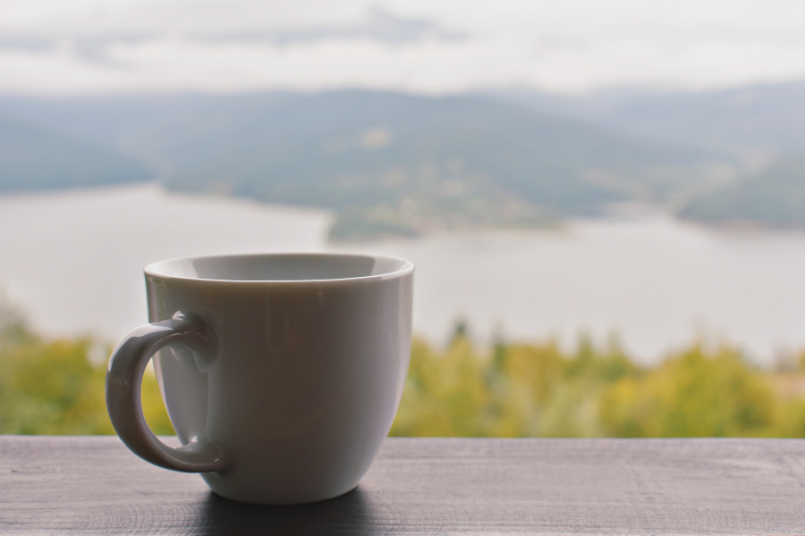coffee cup mountain view - sivanada yoga toronto