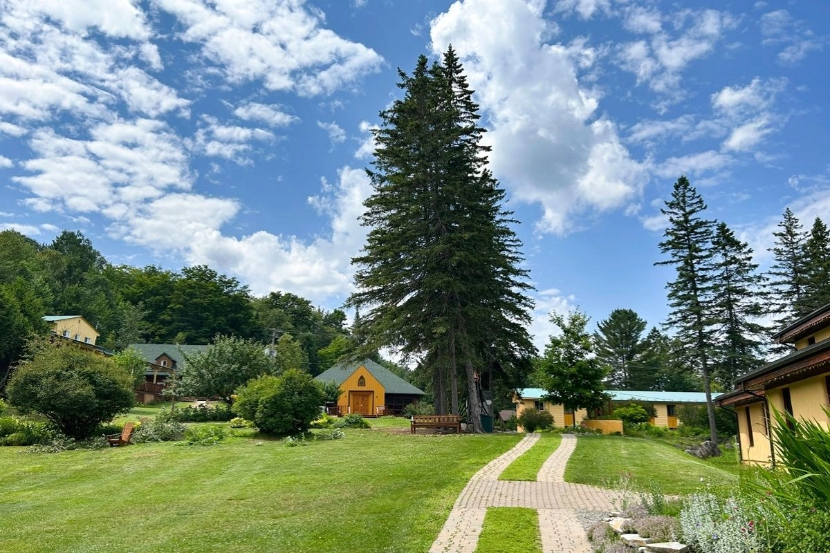 Grounds and buildings of the Sivananda Yoga Camp ashram in Val-Morin, Quebec, in summer